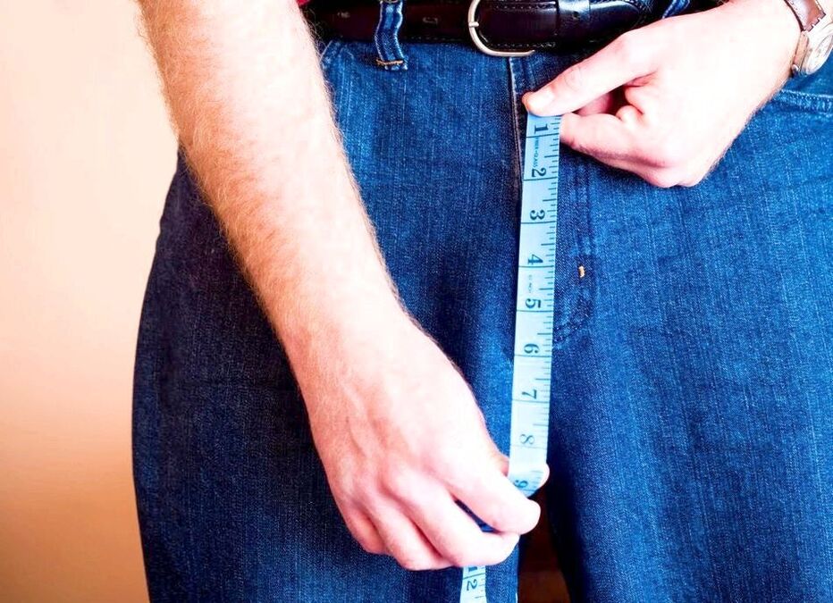 Man measuring enlarged penis